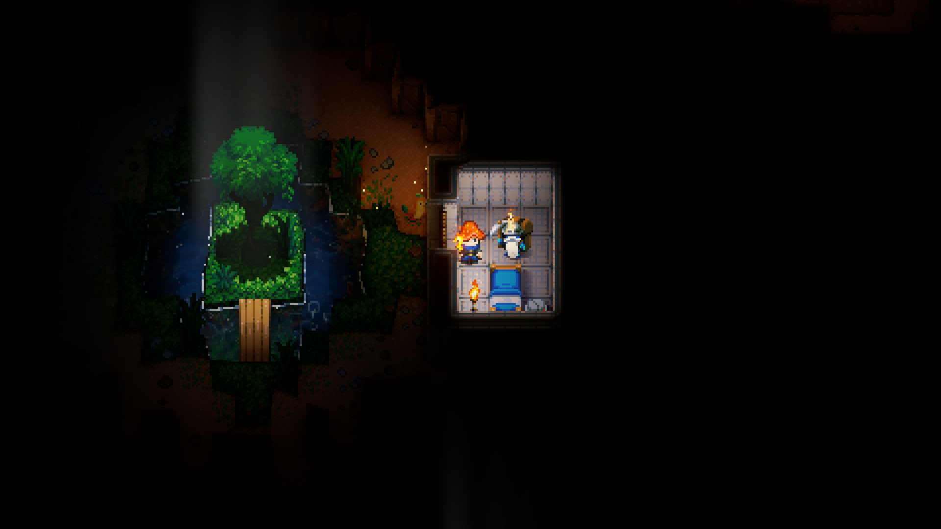 A screenshot from the game Core Keeper shows a player character and the Bearded Merchant standing in a small, well-lit, tiled room. The room contains a bed and a torch surrounded by walls. To the left of the room, a darker, more natural cave environment is visible, with dirt paths, some water, and glowing plant life. A large tree dominates the left side of the image, lit by a beam of light from above.