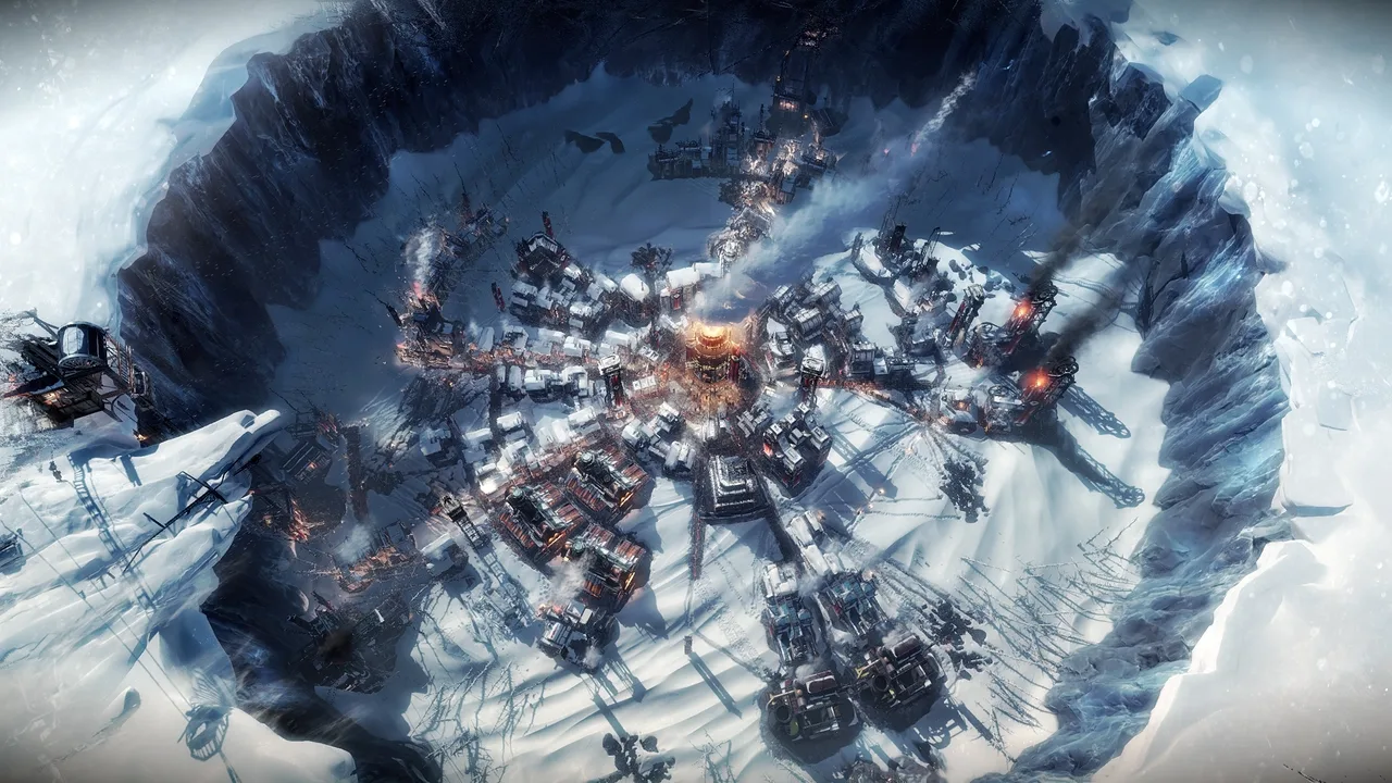 Frostpunk gameplay screenshot showing a grim, snow-covered settlement built around a massive central generator, with intricate industrial buildings all within a large crater.