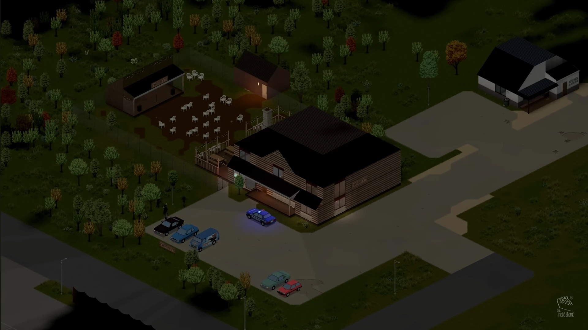 A dark, overhead isometric view of a neighborhood in Project Zomboid. A two-story house with a lit porch is in the foreground, with a police car with flashing blue lights parked outside. Other houses, trees, and what appear to be numerous white zombie figures in a yard are visible under the night sky.