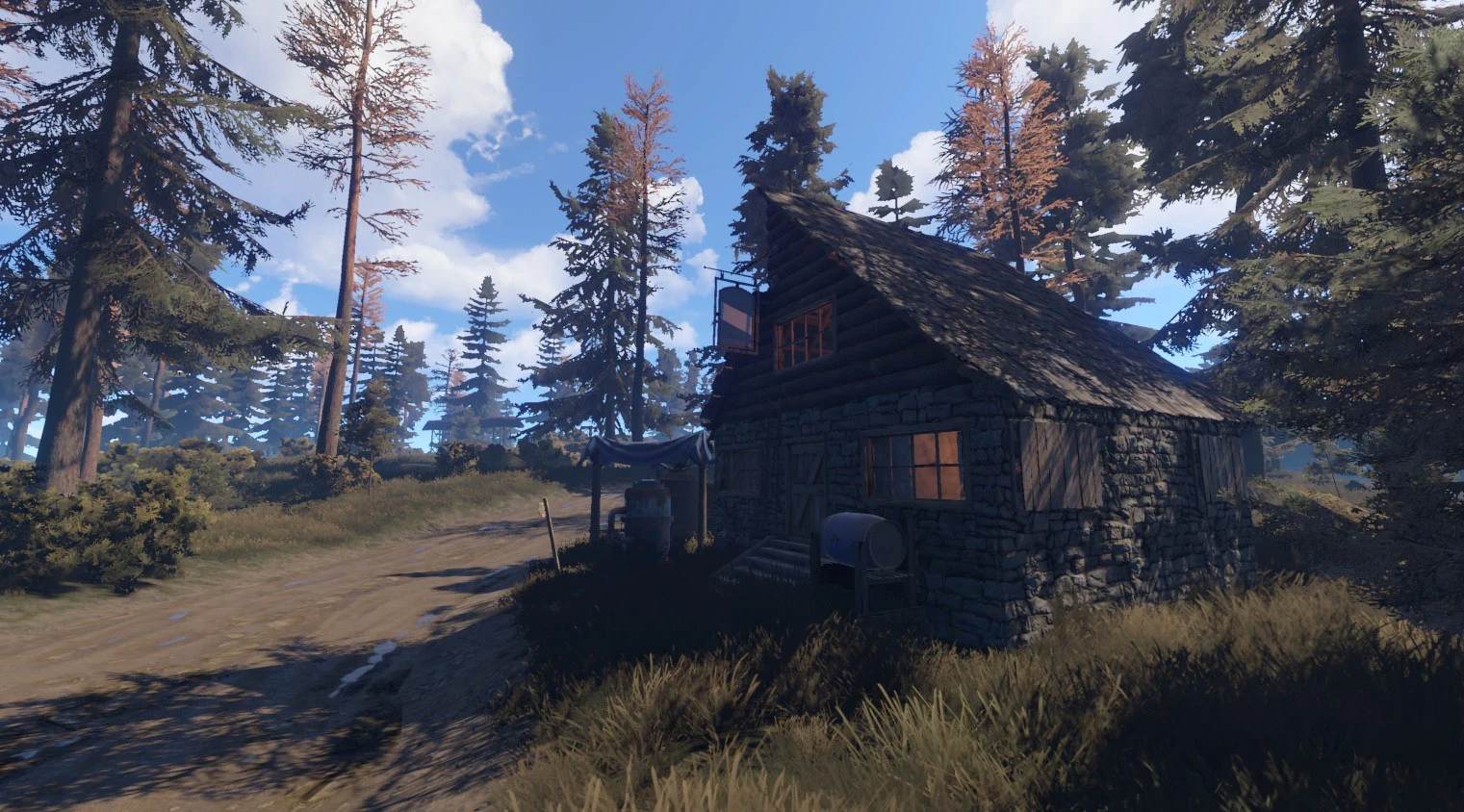 A small, rustic wooden cabin with a stone foundation and a peaked roof, nestled among tall pine trees on a dirt path in the game Rust.