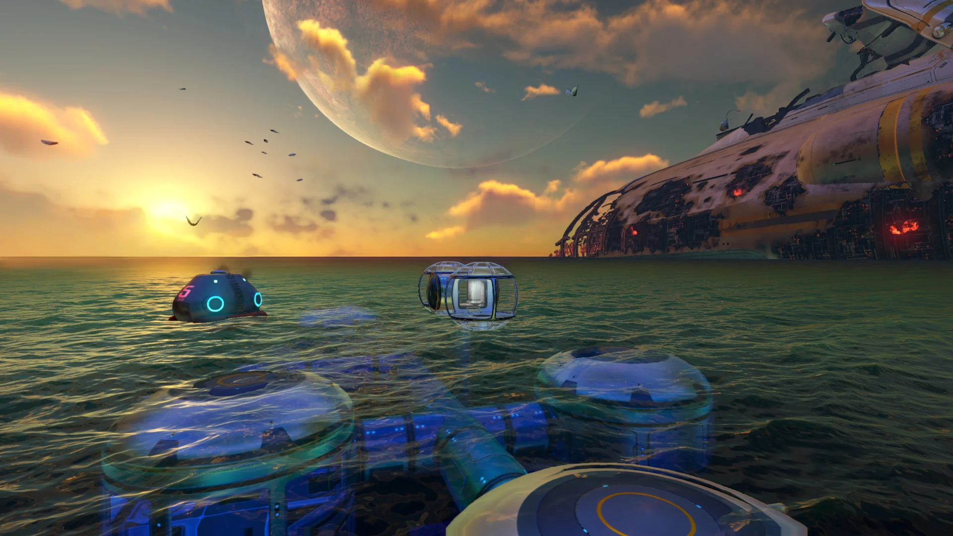An underwater base with modules visible from the ocean surface, a large alien planet and the crashed spaceship, Aurora, in the background, from the game Subnautica.