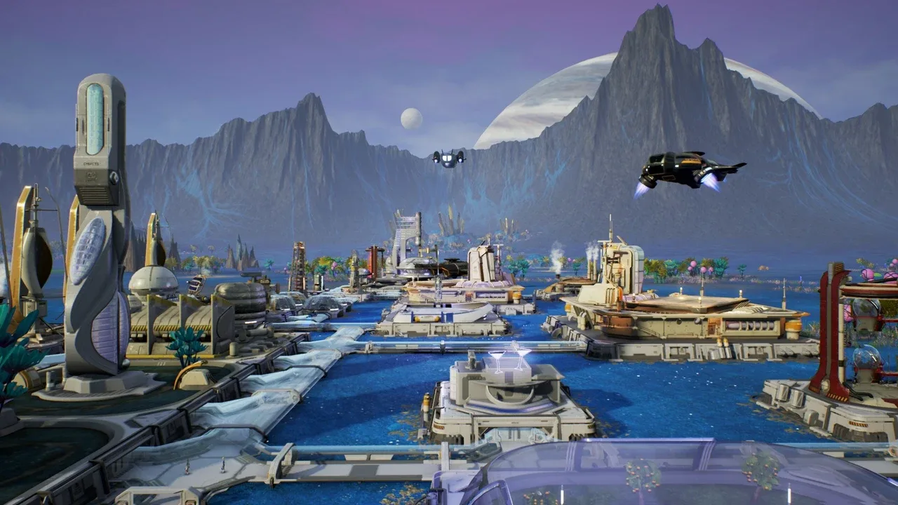A futuristic cityscape on an alien world in Aven Colony. The image shows sleek, modern buildings with flowing architectural lines, situated on platforms over vibrant blue water, surrounded by towering, jagged mountains and a large planetary body in the sky. Several flying vehicles are also visible.