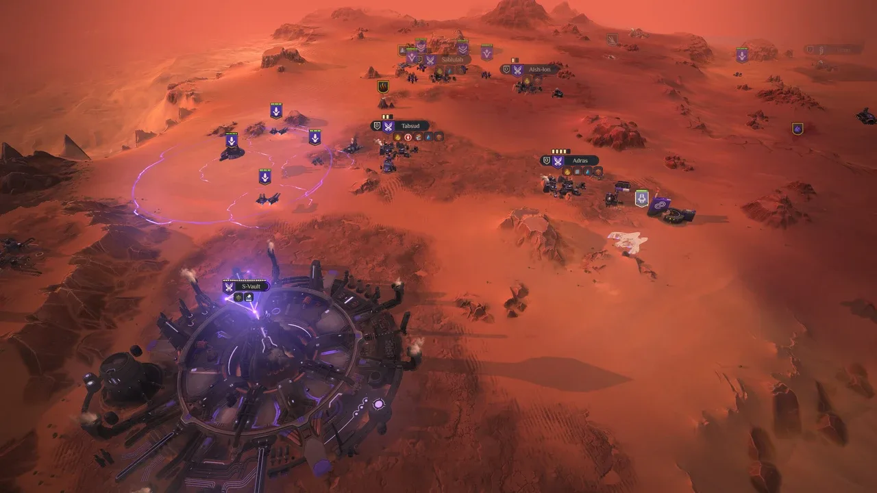 An aerial view of a desert landscape from Dune: Spice Wars, depicting various military units and structures extending from a large circular base, all set against a vast orange, rocky terrain with distant mountains.