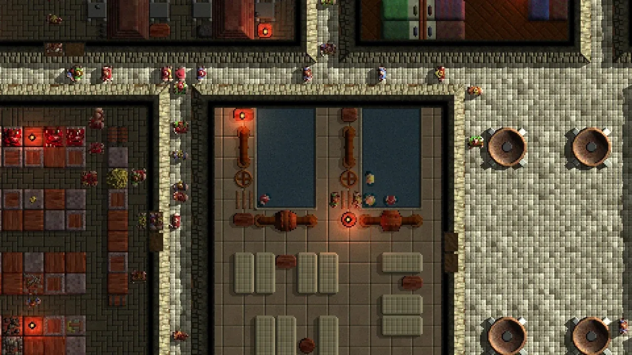 A top-down screenshot of a dense, highly detailed city in Songs of Syx. The image shows numerous buildings, bustling streets filled with tiny citizens, and organized production areas, highlighting the large-scale city-building aspect of the game.